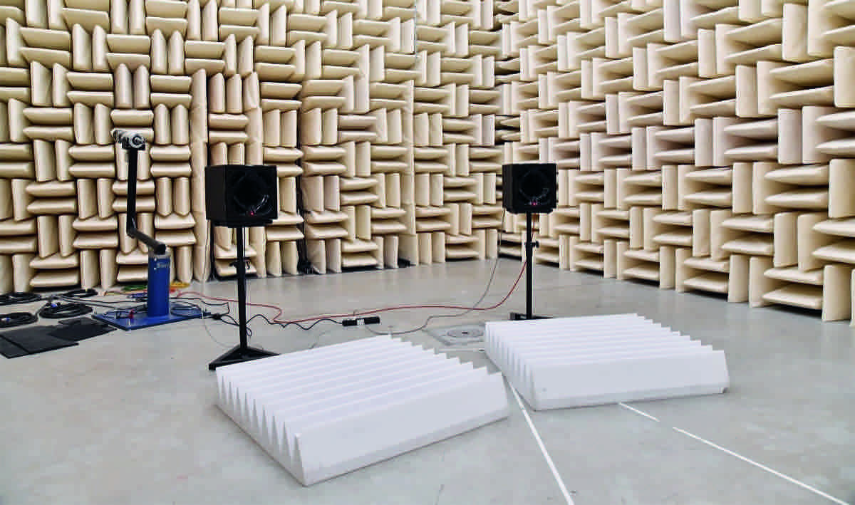 A pair of Square Two monitors on stands in an anechoic chamber